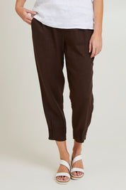 Model Grace wearing size 10 of the Pull On Linen Pant in colour Koko, from the front, cropped image