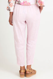 Model Riinar wearing size 10 of the Pull On Linen Pant - Palepink in colour Palepink, from the front