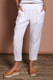 Model Madeline wearing size 10 of the Pull On Linen Pant in colour White (White), from the front, cropped image
