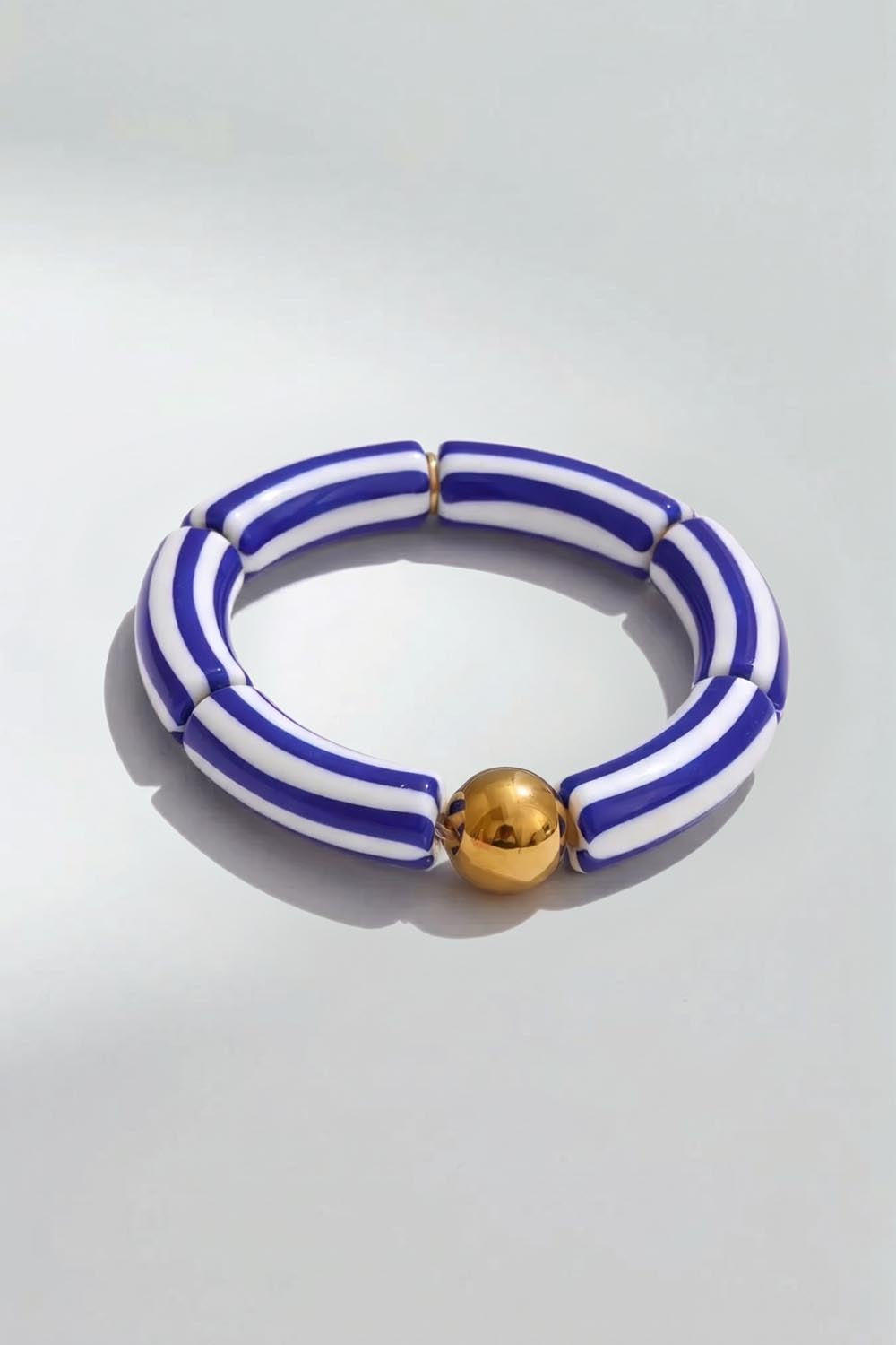 Product shot of the Candy Stripe Stretch Bracelet - Navy in colour Navy, from the back