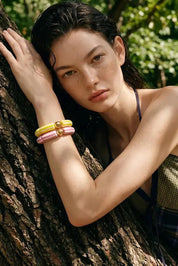 Product shot of the Candy Stripe Stretch Bracelet - Pink in colour Pink, from the back