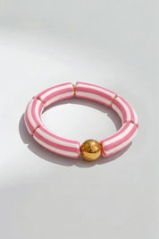 Product shot of the Candy Stripe Stretch Bracelet - Pink in colour Pink, from the front