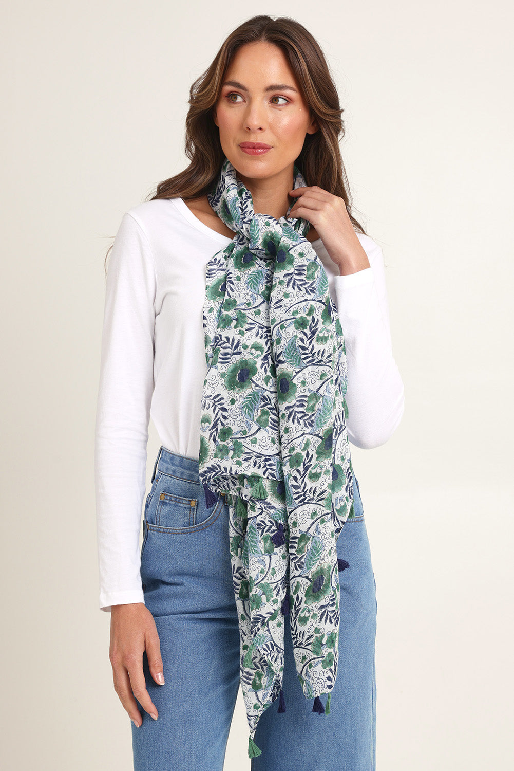 Model Madeline wearing the Caroline Floral Lightweight Scarf in colour Navykhaki, from the front, showing the whole outfit