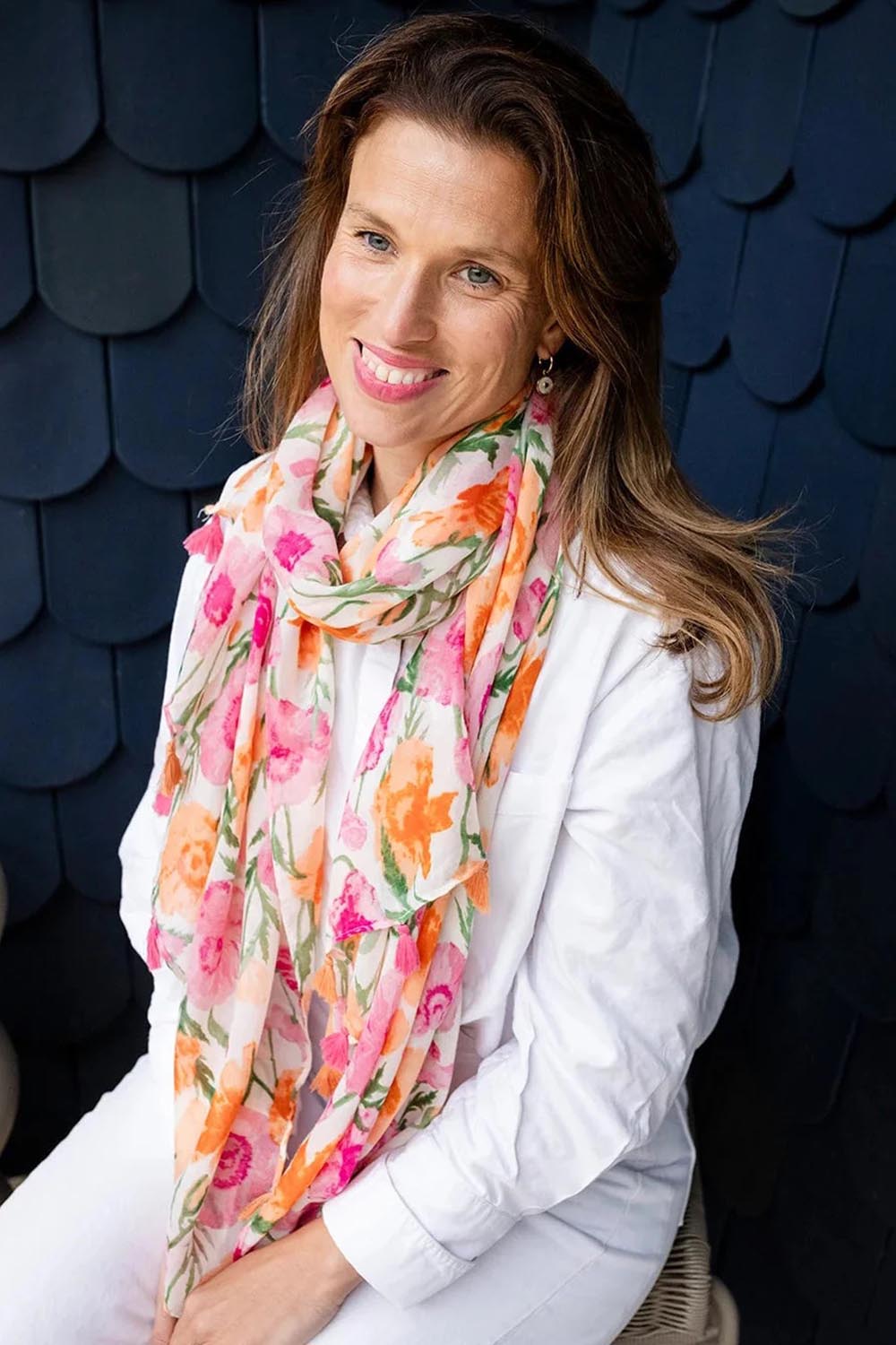 Model Genericm wearing size sample of the Coral Floral Lightweight Scarf - Pinkorange in colour Pinkorange, in a cropped view