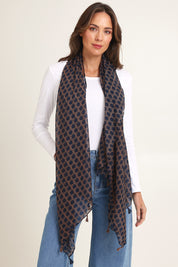 Model Madeline wearing the Dotti Spot Lightweight Scarf in colour Navyspot (Blue), from the front, showing the whole outfit