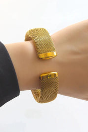 A model wearing the Elegance Mesh Cuff in colour Gold (Metallics), from the front, showing the whole outfit