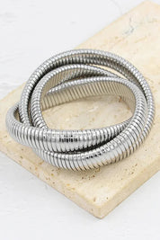 A model wearing the Flex Snake Chain Stretch Bracelet in colour Silver (Metallics), from the front, showing the whole outfit