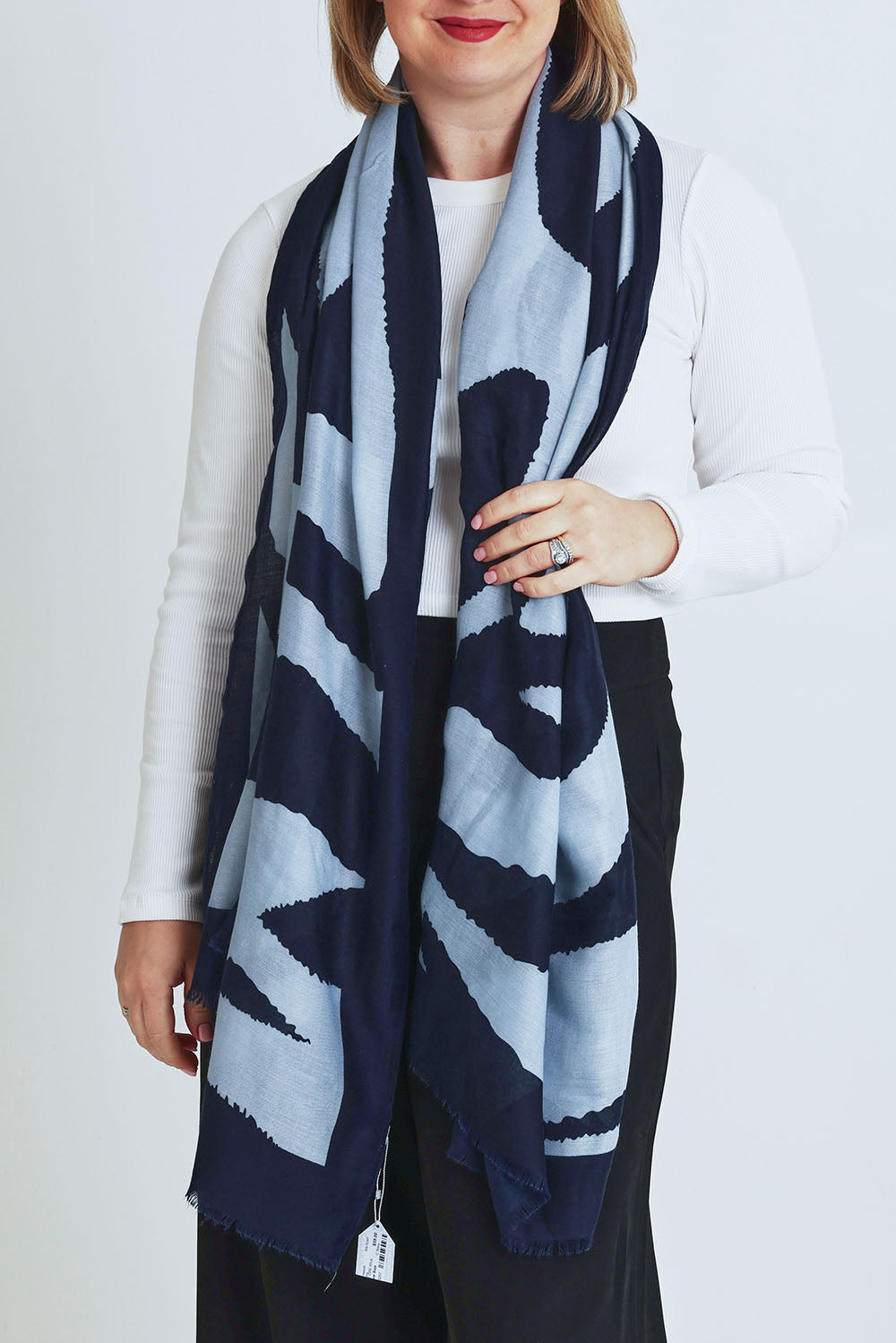 Model Steph wearing the Isla Scarf in colour Navy (Blue), from the front, cropped image