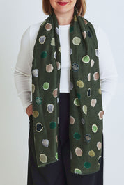 Model Steph wearing the Jamie Scarf in colour Greenspot (Green), from the front, cropped image