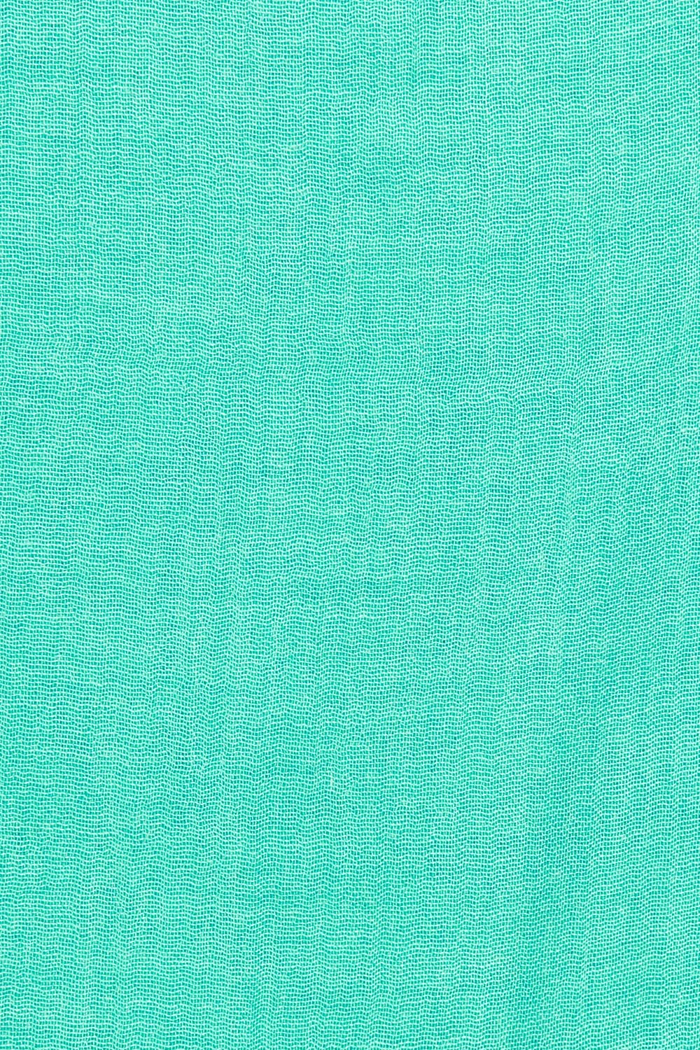 Product shot of the Solid Lightweight Scarf in colour Seafoam (Green), detail