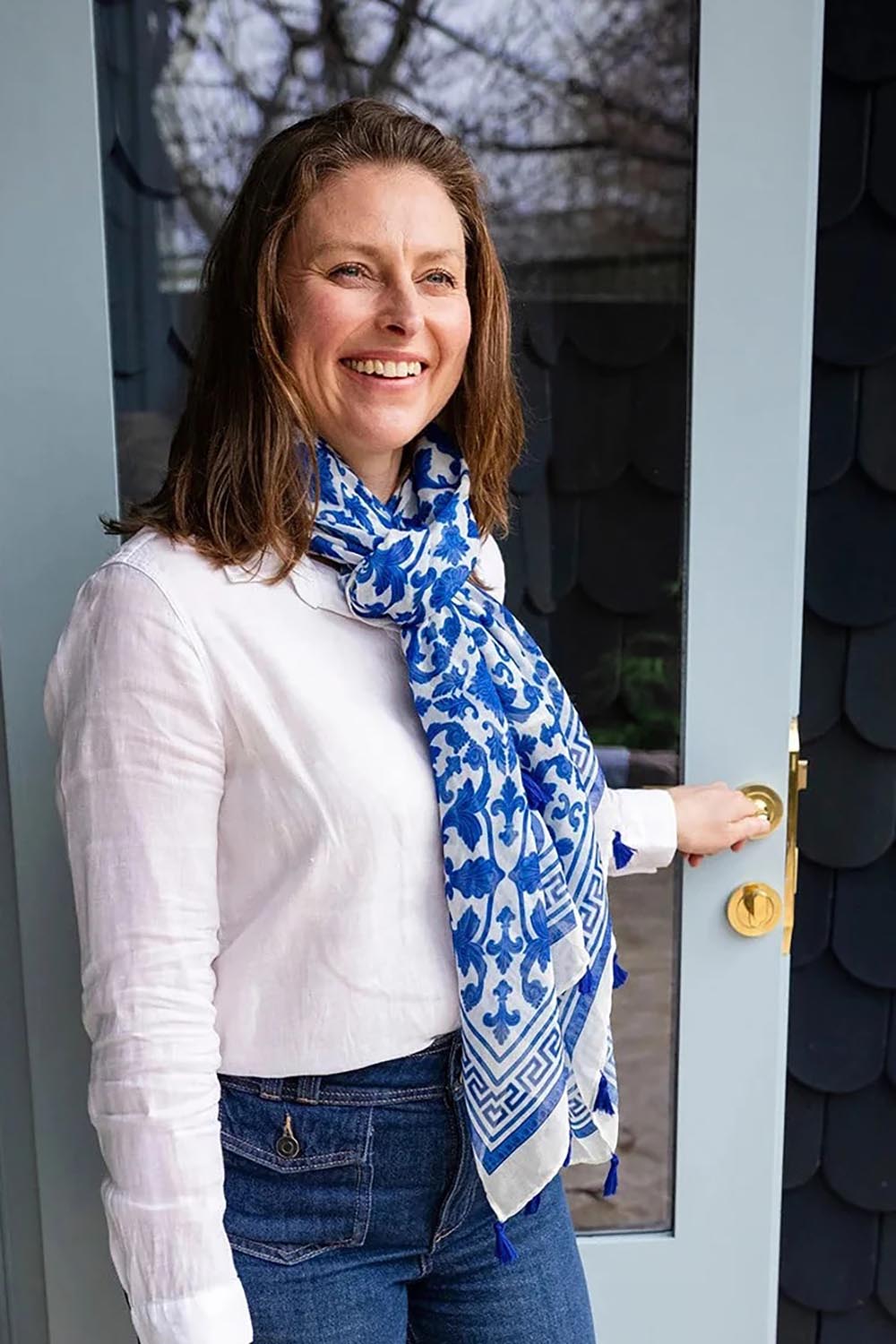 Model Genericm wearing size sample of the Marbella Damask Lightweight Scarf - Blue in colour Blue, in a cropped view