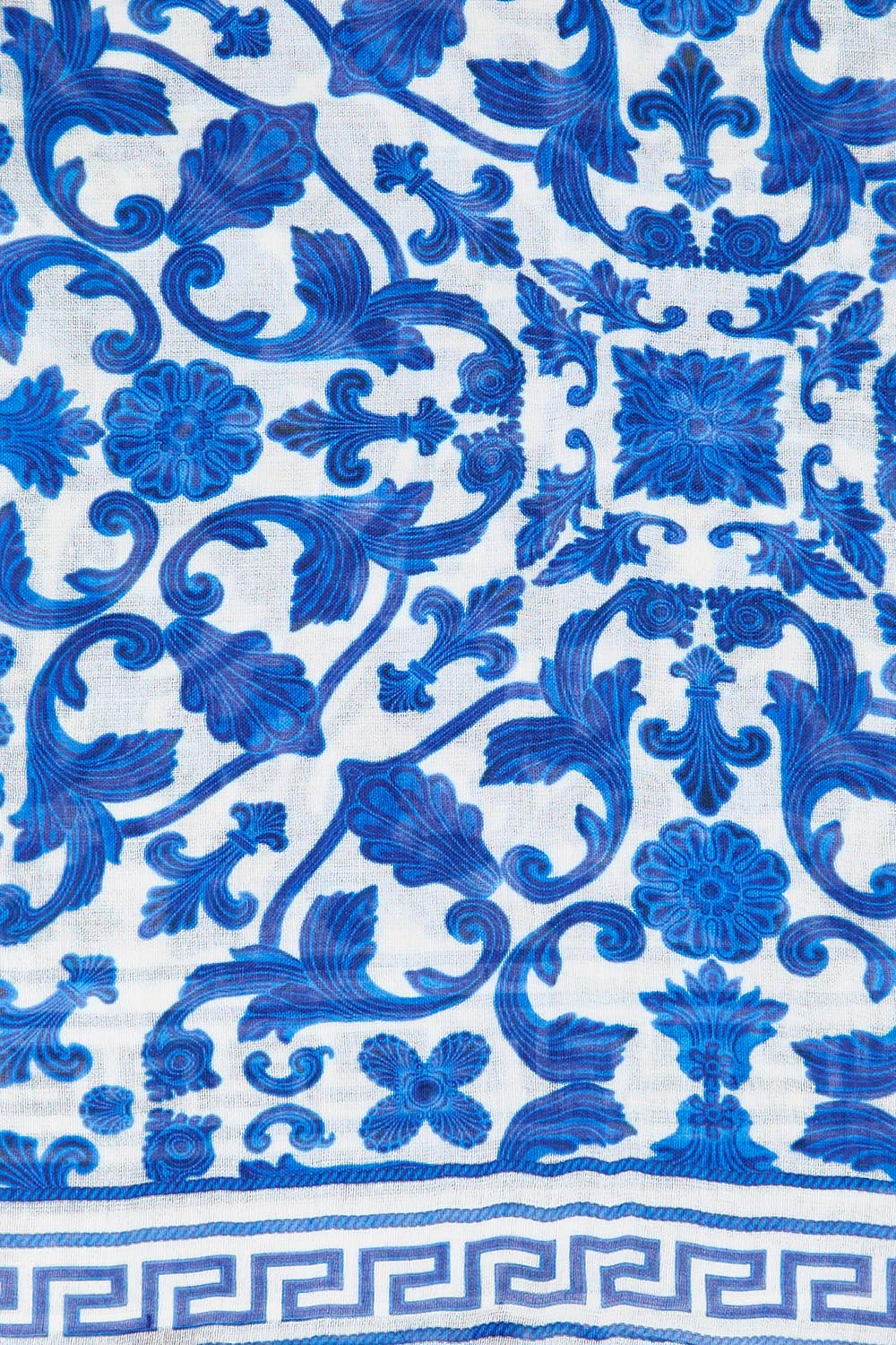 Product shot of the Marbella Damask Lightweight Scarf - Blue in colour Blue, from the back