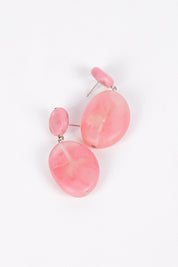 A model wearing size OneSize of the Marble Drop Resin Earring in colour Pink (Pink), from the front, showing the whole outfit