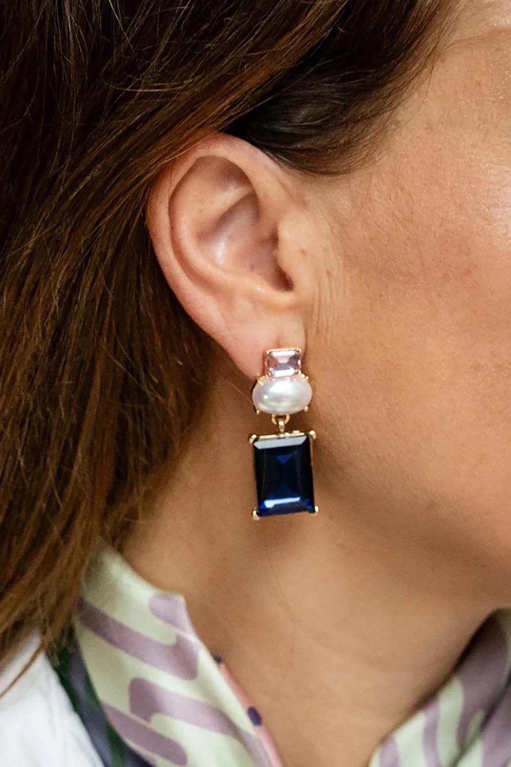 Model Genericm wearing size sample of the Matilda Geometric Crystal Earring - Pinknavy in colour Pinknavy, from an angle