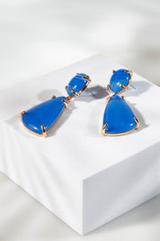 A model wearing size OneSize of the Resin Drop Earrings in colour Blue (Blue), from the front, showing the whole outfit