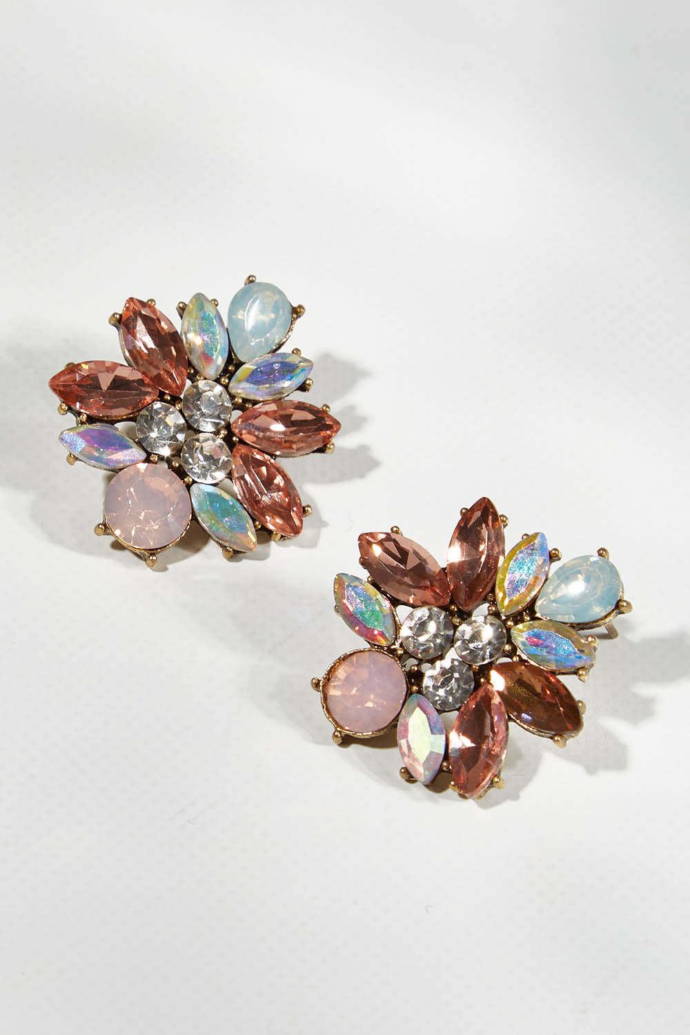 A model wearing size OneSize of the Medium Bling Earrings in colour Champagne (Pink), from the front, showing the whole outfit