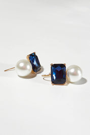 A model wearing size OneSize of the Medium Bling Earrings in colour Navypearl (Blue), from the front, showing the whole outfit