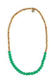 Product shot of the Mini Wood & Rock Necklace in colour Emerald (Green), from the front