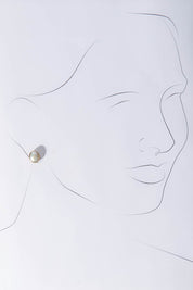A model wearing size OneSize of the Bezel Set Pearl Stud in colour Gold (Metallics), from the front, showing the whole outfit