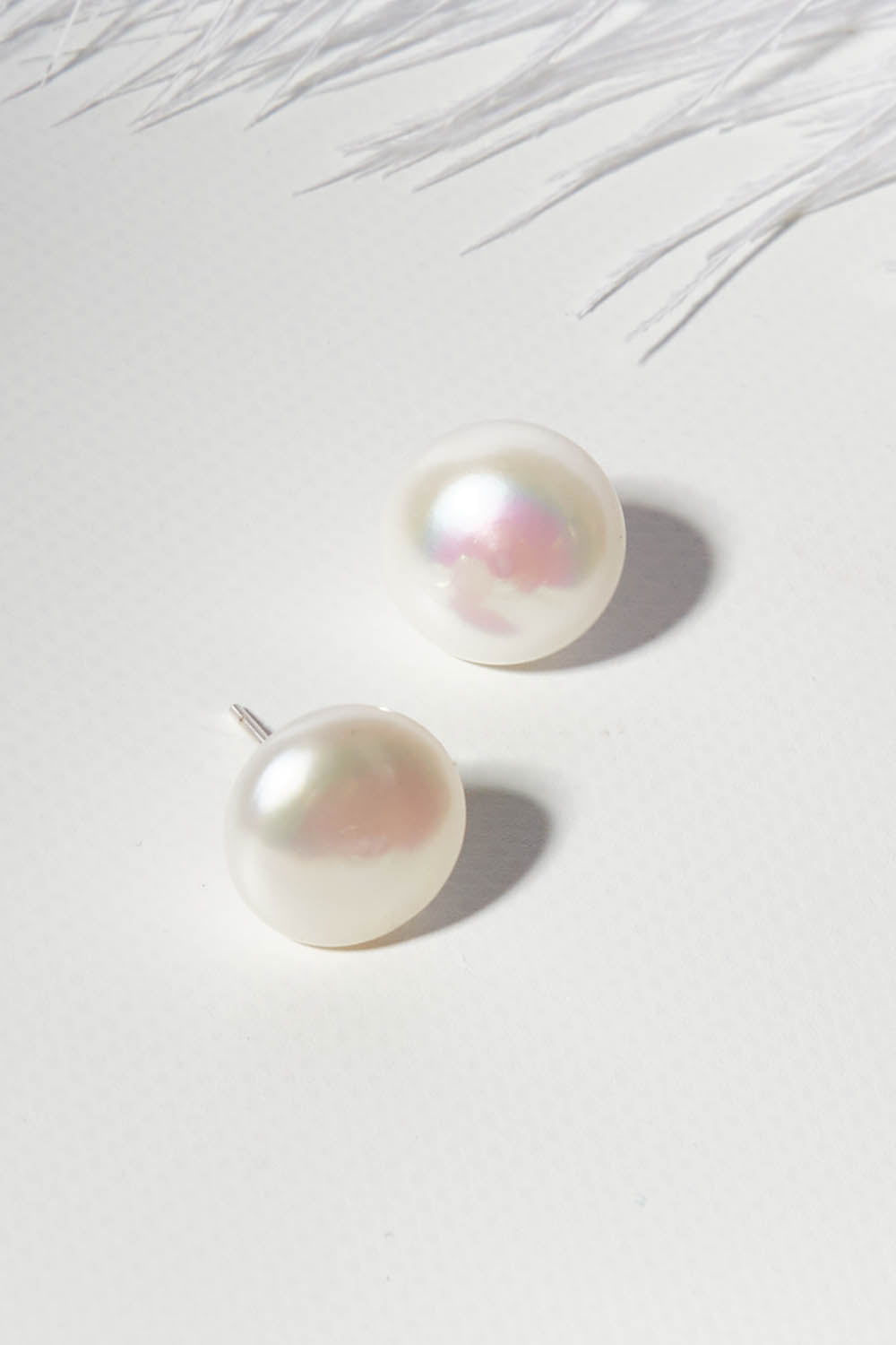 A model wearing size OneSize of the Sterling Silver Medium Pearl Stud in colour Silver (White), from the front, showing the whole outfit