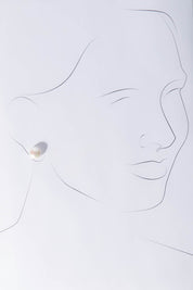 A model wearing size OneSize of the Sterling Silver Medium Pearl Stud in colour Silver (White), from the front, showing the whole outfit