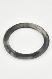 A model wearing the Point Resin Stacking Bangle in colour Black (Black), from the front, showing the whole outfit
