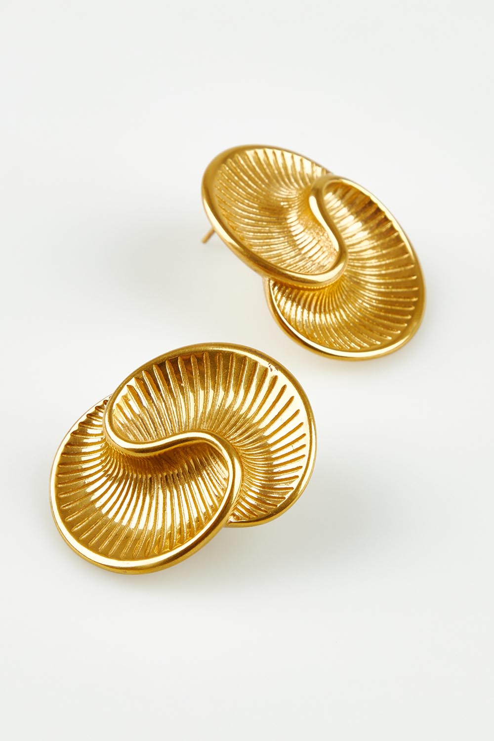 A model wearing the Prudence Sculptural Fan Earrings in colour Gold (Metallics), from the front, showing the whole outfit