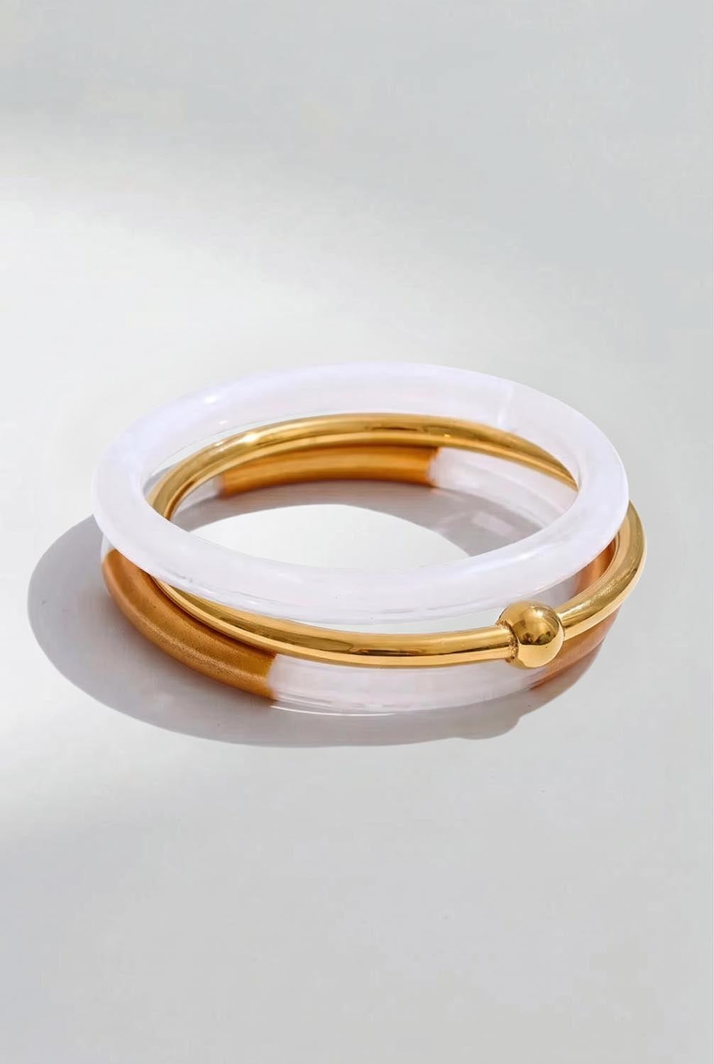 Product shot of the Riviera 3 Stack Bangle - White in colour White, from the front