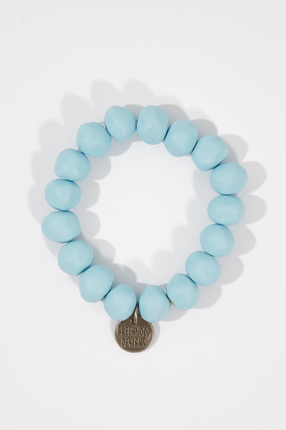 A model wearing size OneSize of the Rock Resin Bracelet in colour BabyBlue (Blue), from the front, showing the whole outfit