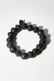A model wearing size OneSize of the Rock Resin Bracelet in colour Blkmarble (Black), from the front, showing the whole outfit
