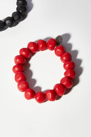 A model wearing size OneSize of the Rock Resin Bracelet in colour Red (Red), from the front, showing the whole outfit