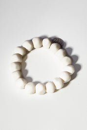 A model wearing size OneSize of the Rock Resin Bracelet in colour White (White), from the front, showing the whole outfit