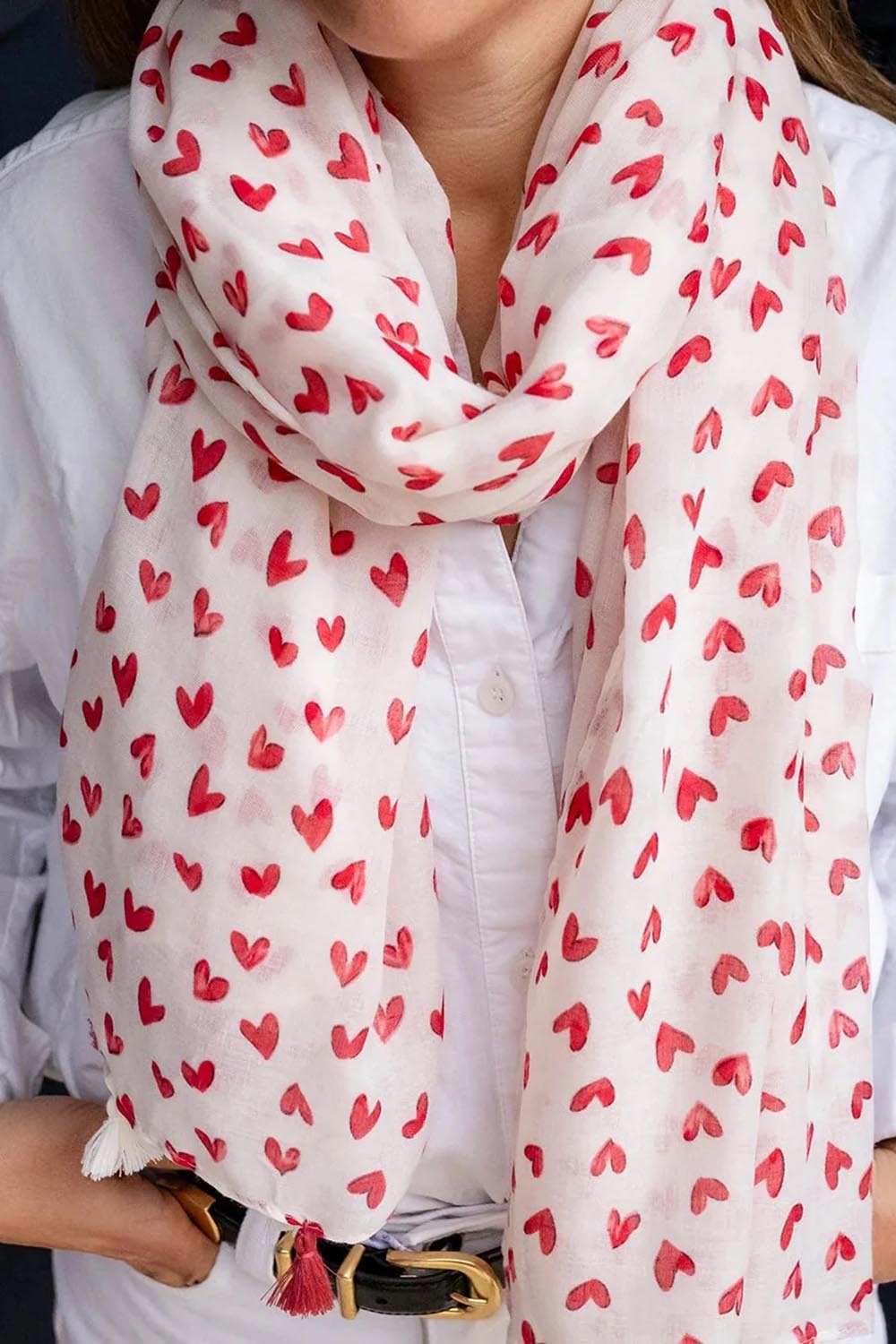 Model Genericm wearing size sample of the Ruby Heart Lightweight Scarf - Red in colour Red, in a cropped view