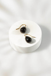 A model wearing size OneSize of the Enamel Drop Earrings in colour Black (Black), from the front, showing the whole outfit