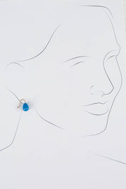 A model wearing size OneSize of the Enamel Drop Earrings in colour Blue (Blue), from the front, showing the whole outfit