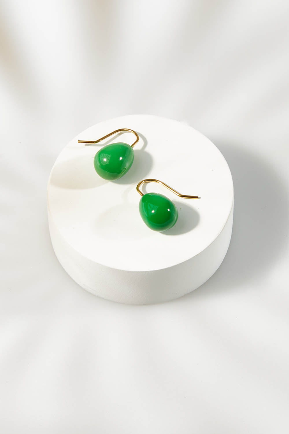 A model wearing size OneSize of the Enamel Drop Earrings in colour Green (Green), from the front, showing the whole outfit