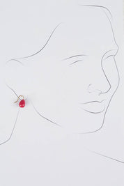 A model wearing size OneSize of the Enamel Drop Earrings in colour Hotpink (Pink), from the front, showing the whole outfit