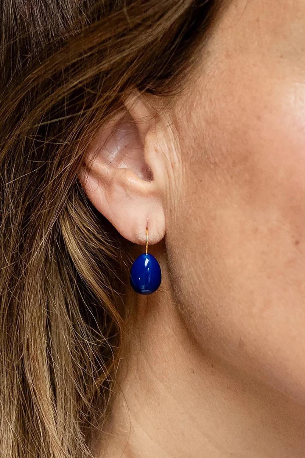 Model Genericm wearing size sample of the Alice Enamel Drop Earrings - Navy in colour Navy, from an angle