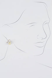 A model wearing size OneSize of the Enamel Drop Earrings in colour White (White), from the front, showing the whole outfit