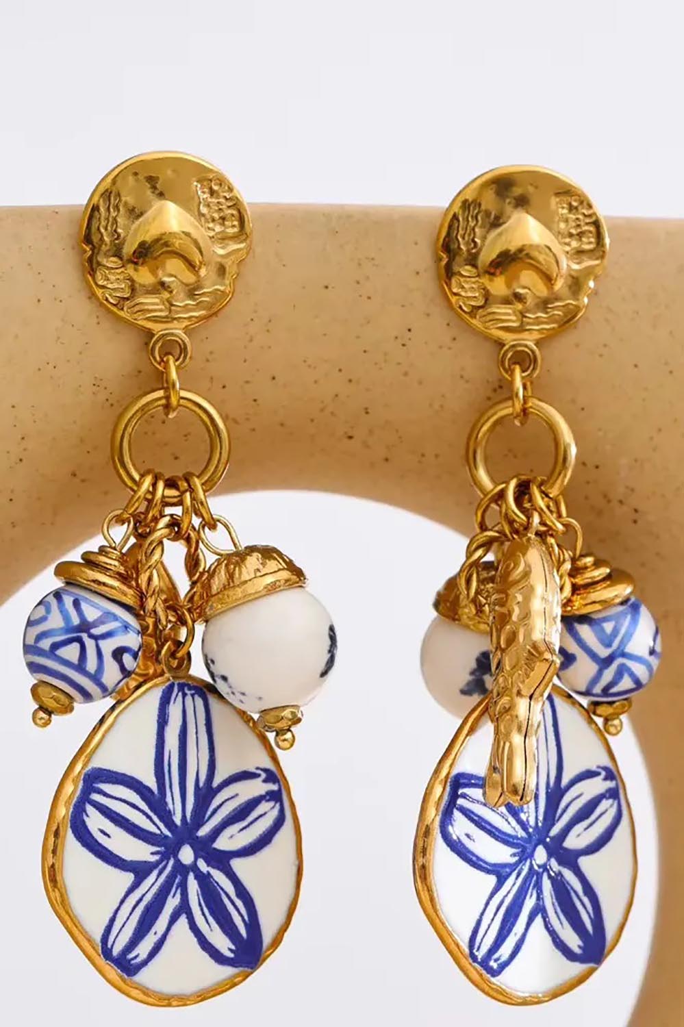 Product shot of the Sorrento Charm Earring - Bluewhite in colour Bluewhite, from the front