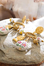 Product shot of the St Tropez Floral Charm Earring - Multi in colour Multi, from the back