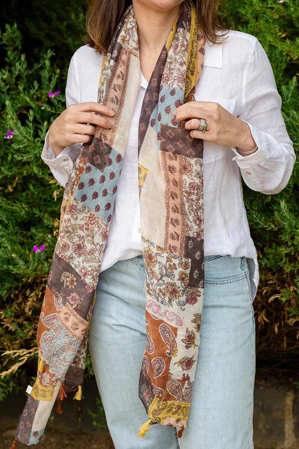 Model Genericm wearing size sample of the Tara Patchwork Lightweight Scarf - Patchwork in colour Patchwork, in a cropped view