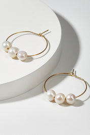 A model wearing size OneSize of the Freshwater Triple Pearl Hoop Earring in colour Gold (Metallics), from the front, showing the whole outfit