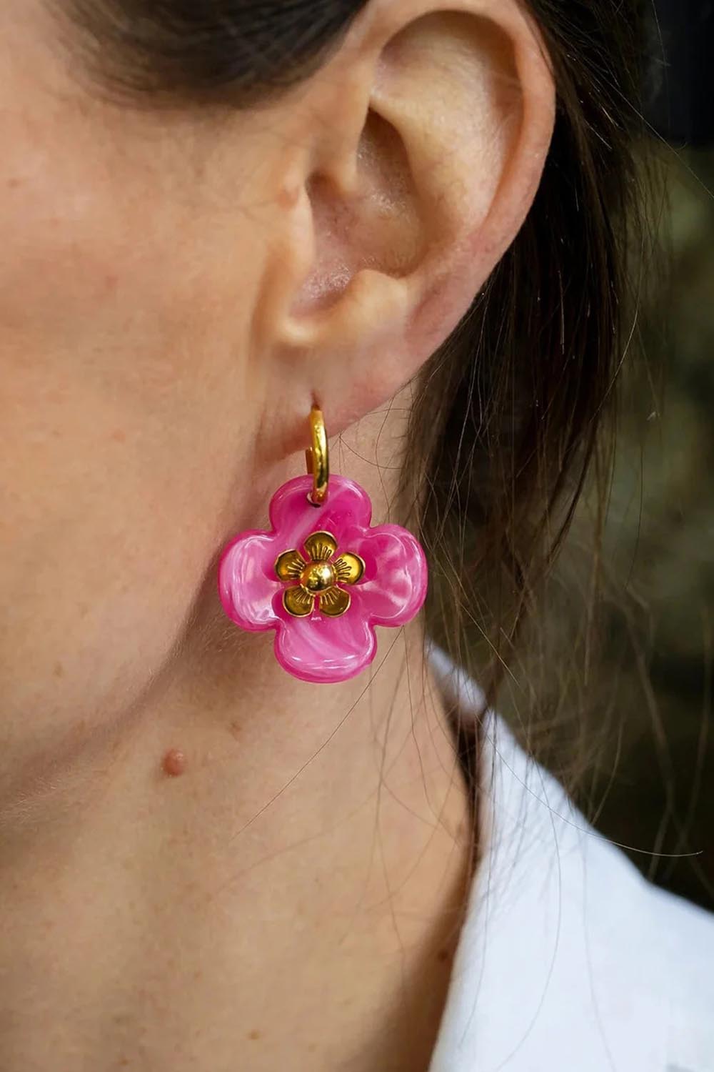 Model Genericm wearing size sample of the Willa Flower Hoop Earring - Darkpink in colour Darkpink, in a cropped view