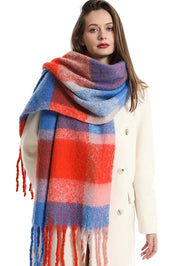 A model wearing the Charlie Checker Scarf in colour Blueorange (Blue), from the front, showing the whole outfit