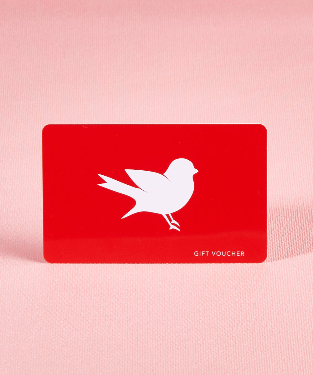 A model wearing the $100 Gift Voucher in colour Red (undefined), from the front, showing the whole outfit