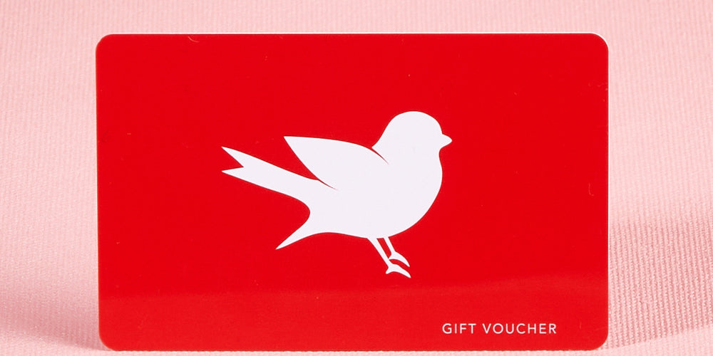 A model wearing the $100 Gift Voucher in colour Red (undefined), from the front, showing the whole outfit