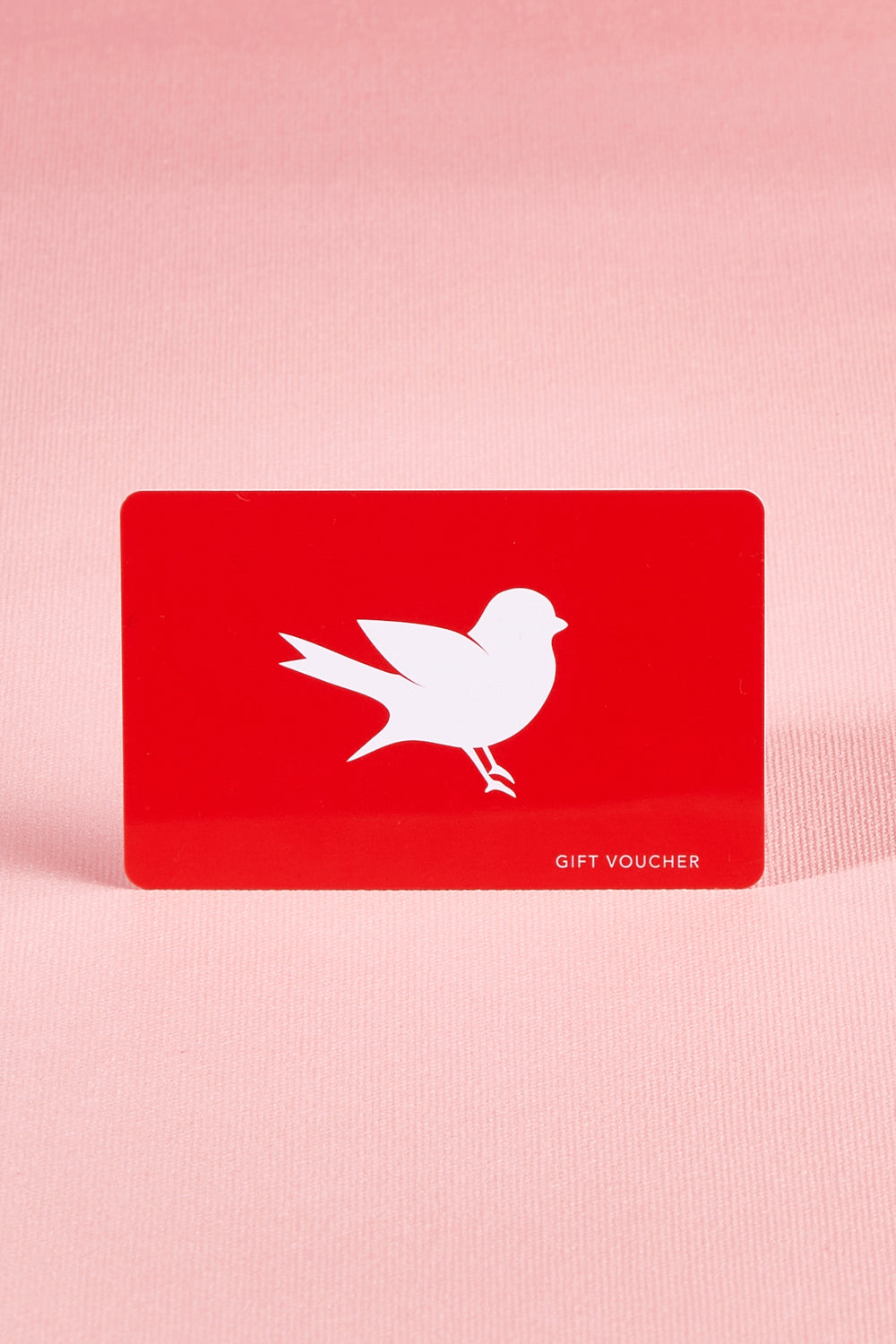A model wearing the $150 Gift Voucher in colour Red (undefined), from the front, showing the whole outfit