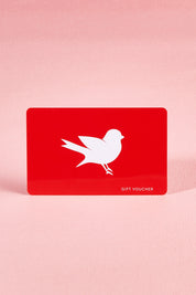A model wearing the $50 Gift Voucher in colour Red (undefined), from the front, showing the whole outfit