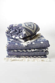 A model wearing size OneSize of the Hammamas Aztec Towel in colour Navy (Blue), from the front, showing the whole outfit